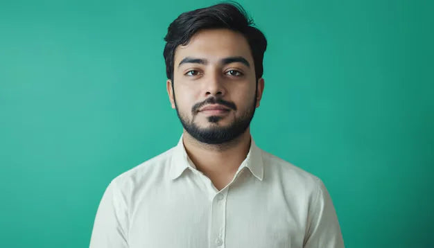 man-with-beard-white-shirt-that-says-he-is-posing-photo_875765-5547 - Zomo
